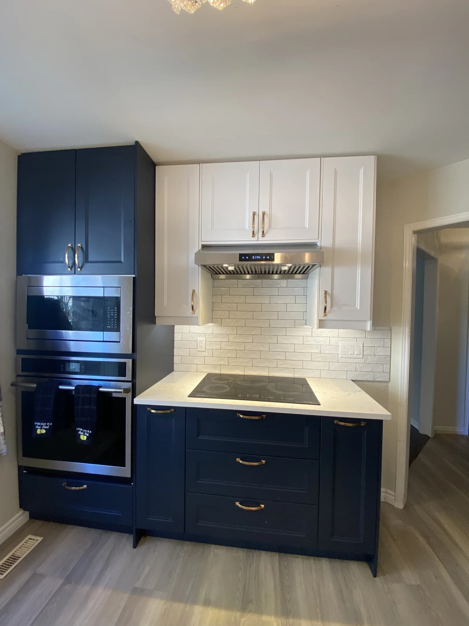 Premium kitchen with navy cabinetry by Meadus Contracting
